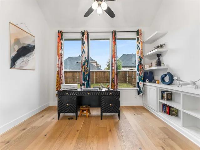 a kitchen with cabinets and window