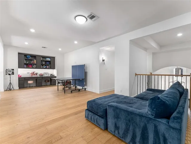a bathroom with a sink mirror and toilet