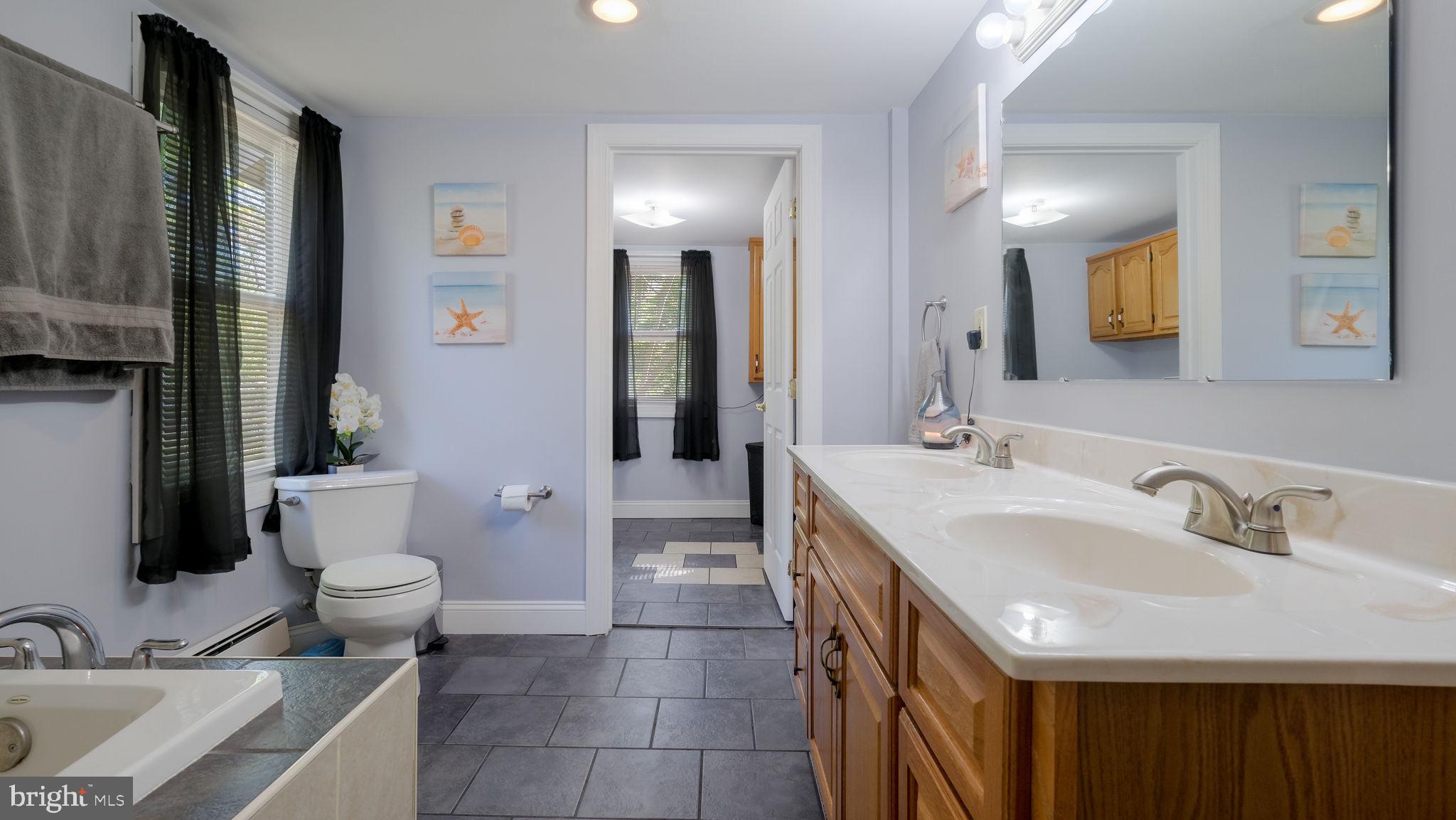 500 Prospect Road Warminster, PA 18974 - Photo 19 of 28 a bathroom with a sink toilet and mirror