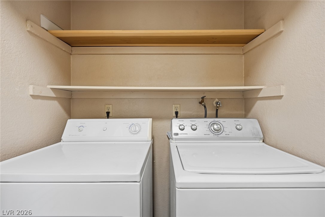3971 Spring Leaf Drive Las Vegas, NV 89147 - Photo 30 of 48 Functional laundry nook provides practical space for household chores with built-in shelving.