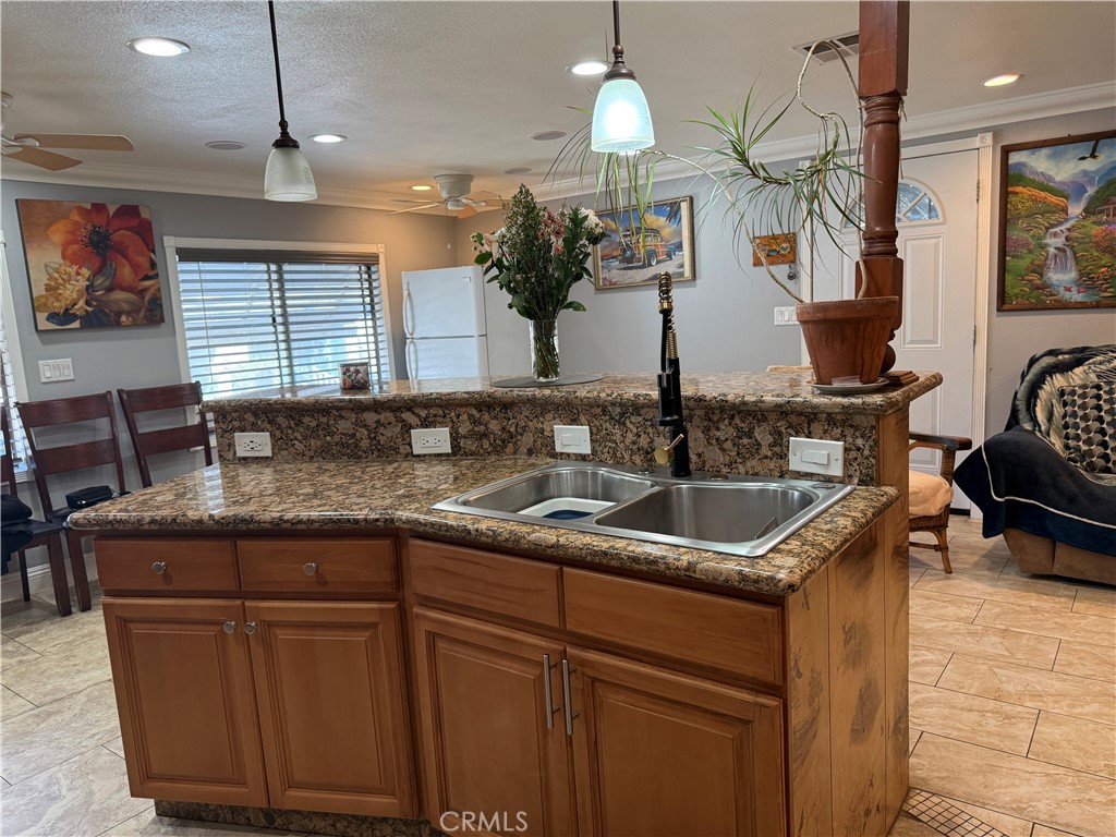 20683 Waalew Road, Unit B37 Apple Valley, CA 92307 - Photo 12 of 24 a kitchen with sink and cabinets