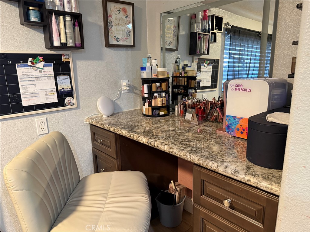 20683 Waalew Road, Unit B37 Apple Valley, CA 92307 - Photo 8 of 24 a kitchen counter top space with granite countertop furniture and a wooden floor