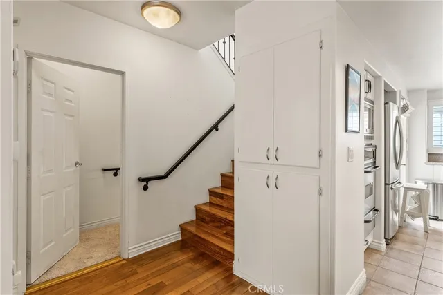 a view of bathroom with a sink and a washer dryer