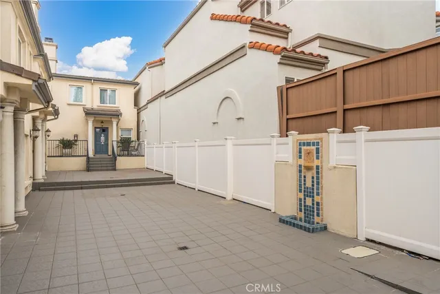 a living room with furniture and a view of kitchen
