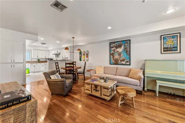 a living room with fireplace furniture and a window
