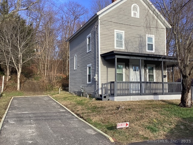 42 Litchfield Street Thomaston, CT 06787 - Photo 1 of 1 a front view of a house with garden