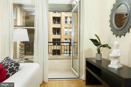 915 E Street Northwest, Unit 714 Washington, DC 20004 - Photo 8 of 14 a living room with furniture