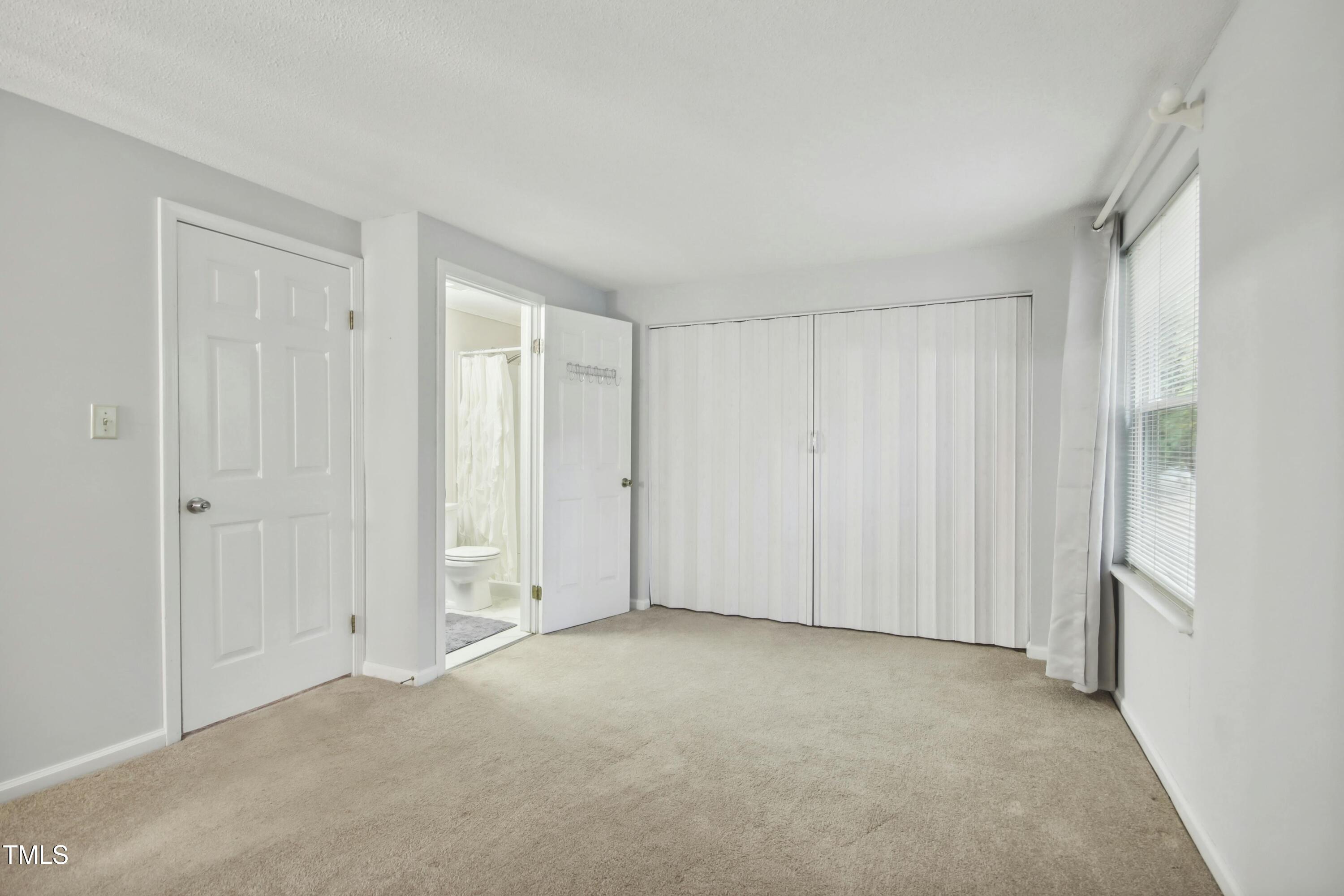 7803 Stephanie Lane Raleigh, NC 27615 - Photo 14 of 30 a view of an empty room and closet area