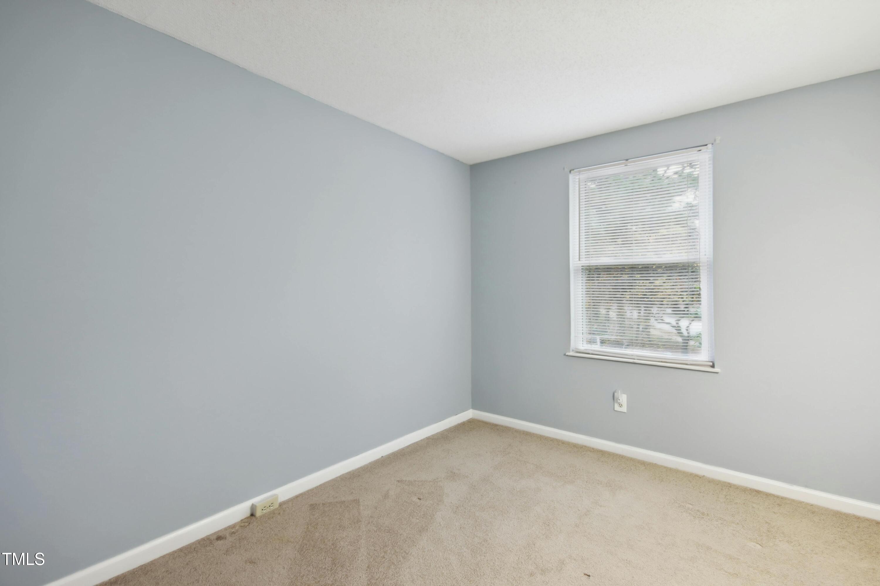 7803 Stephanie Lane Raleigh, NC 27615 - Photo 20 of 30 an empty room with a window