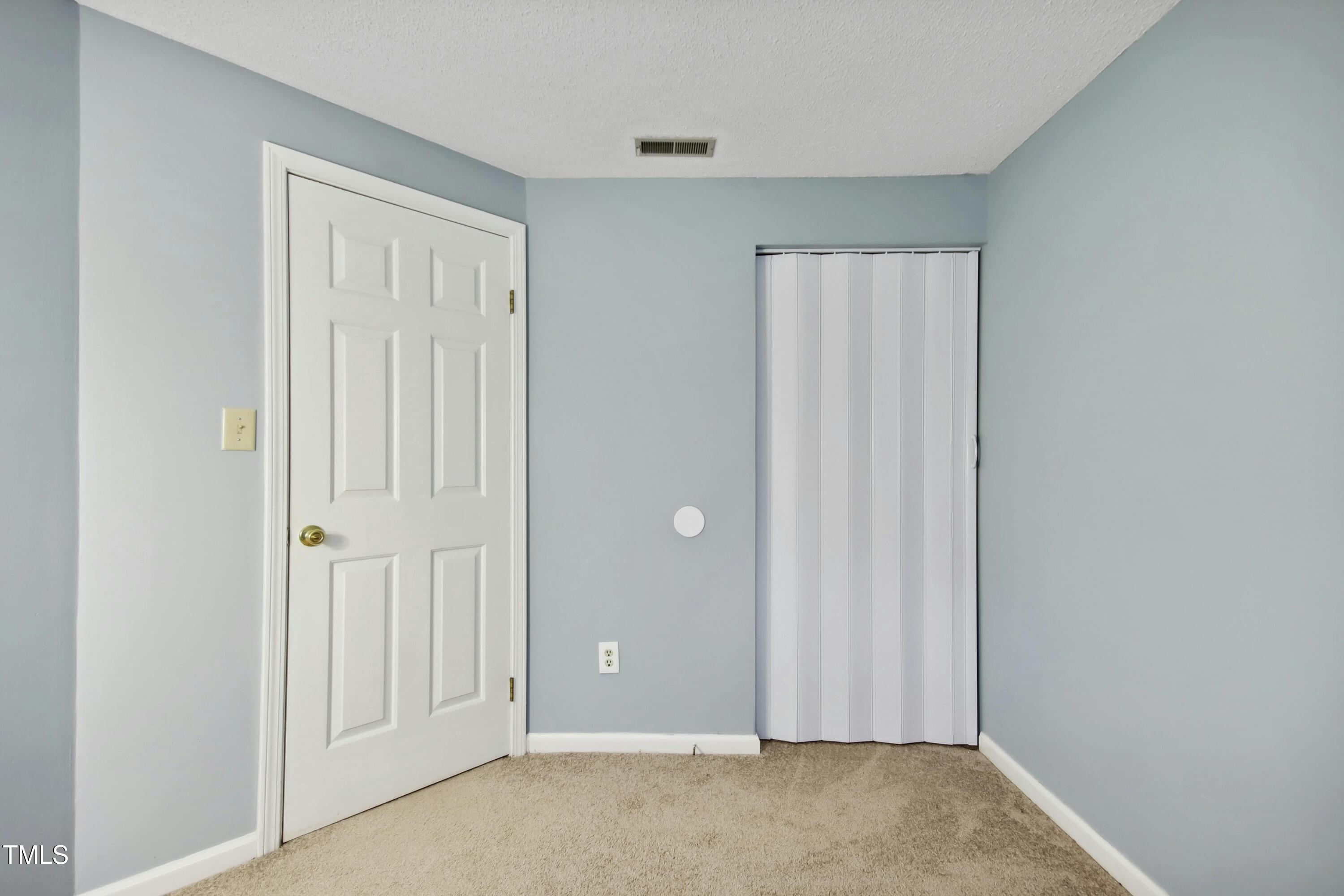 7803 Stephanie Lane Raleigh, NC 27615 - Photo 21 of 30 an empty room with closet area
