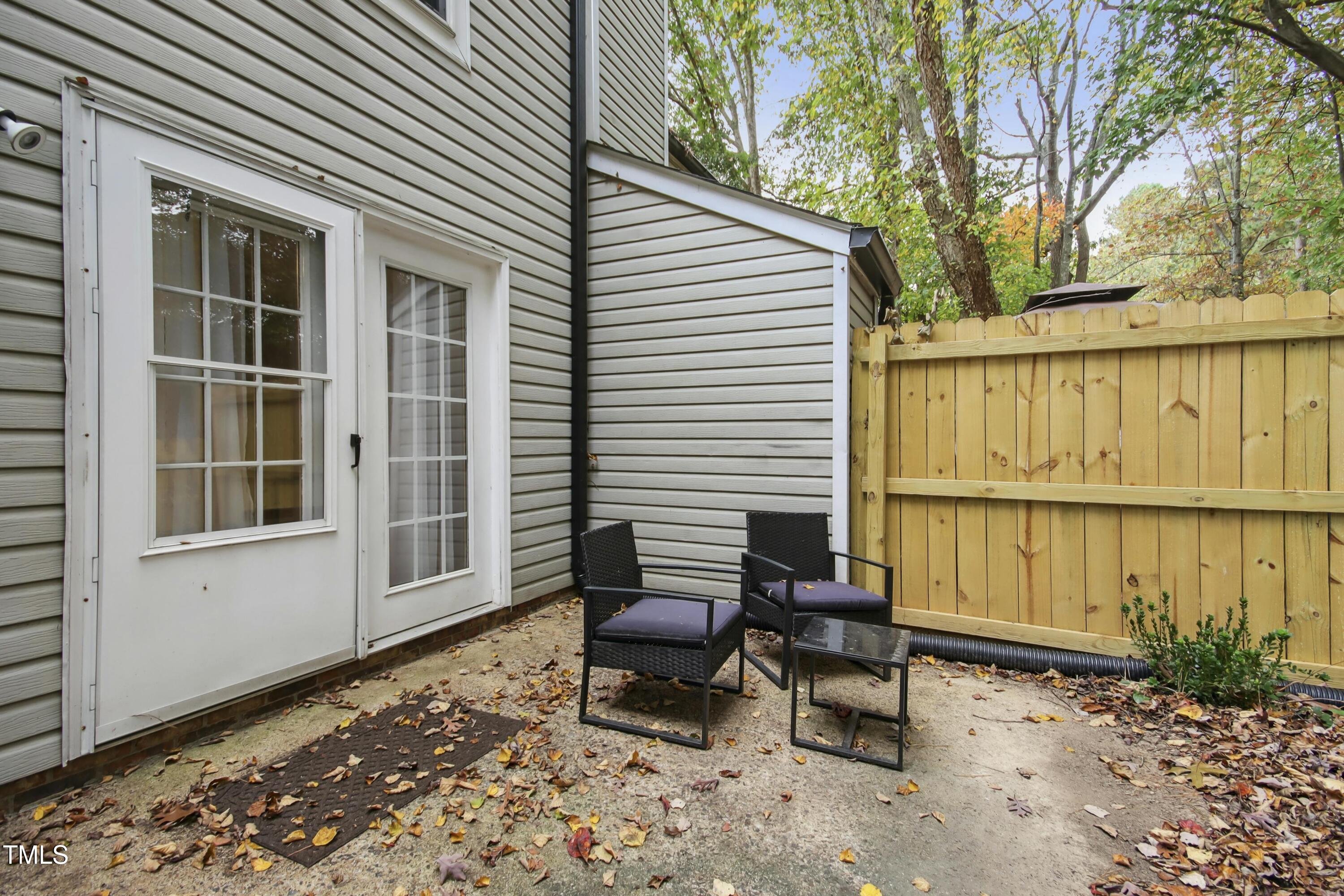 7803 Stephanie Lane Raleigh, NC 27615 - Photo 22 of 30 a backyard of a house with outdoor seating