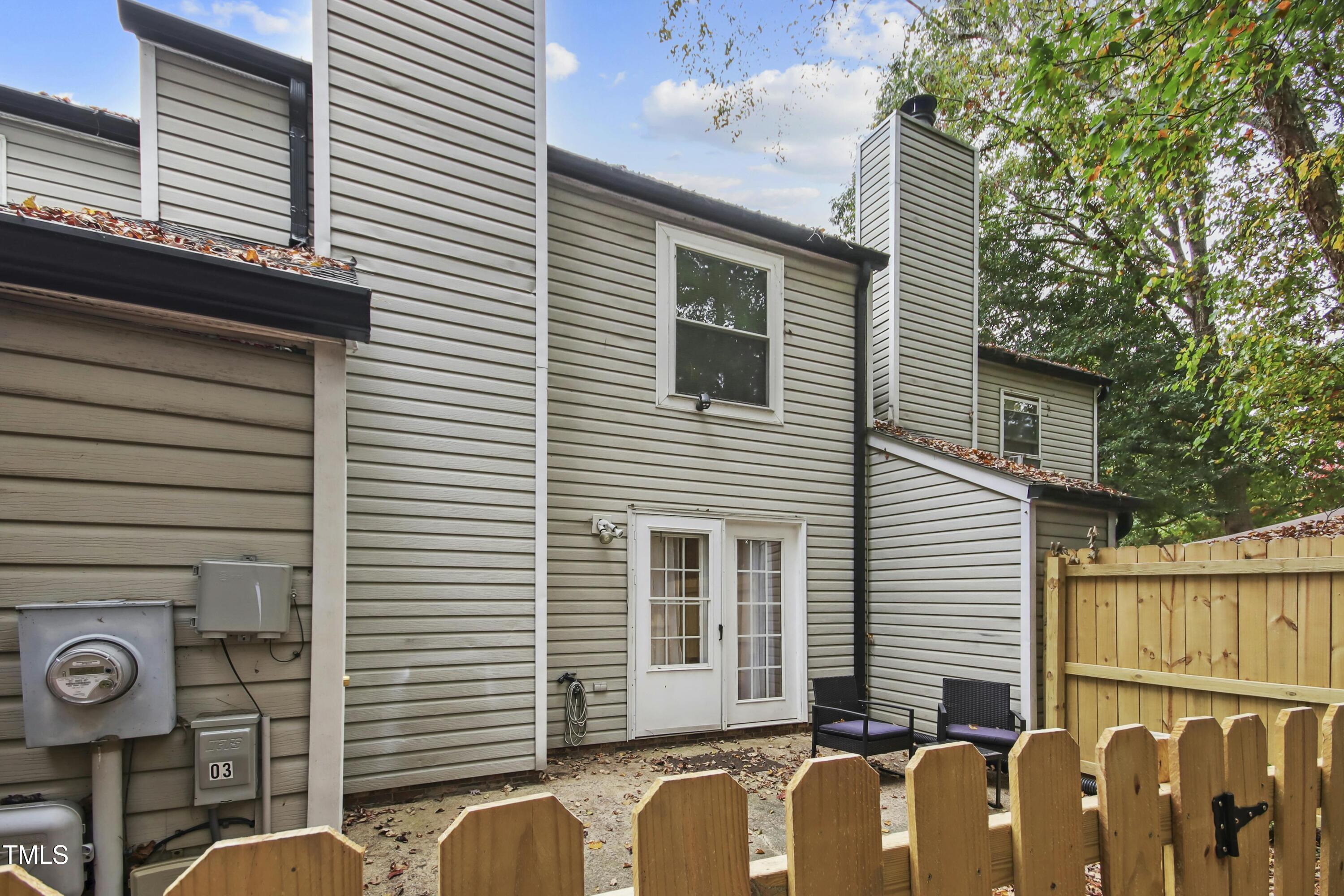 7803 Stephanie Lane Raleigh, NC 27615 - Photo 24 of 30 a view of a house with a brick wall