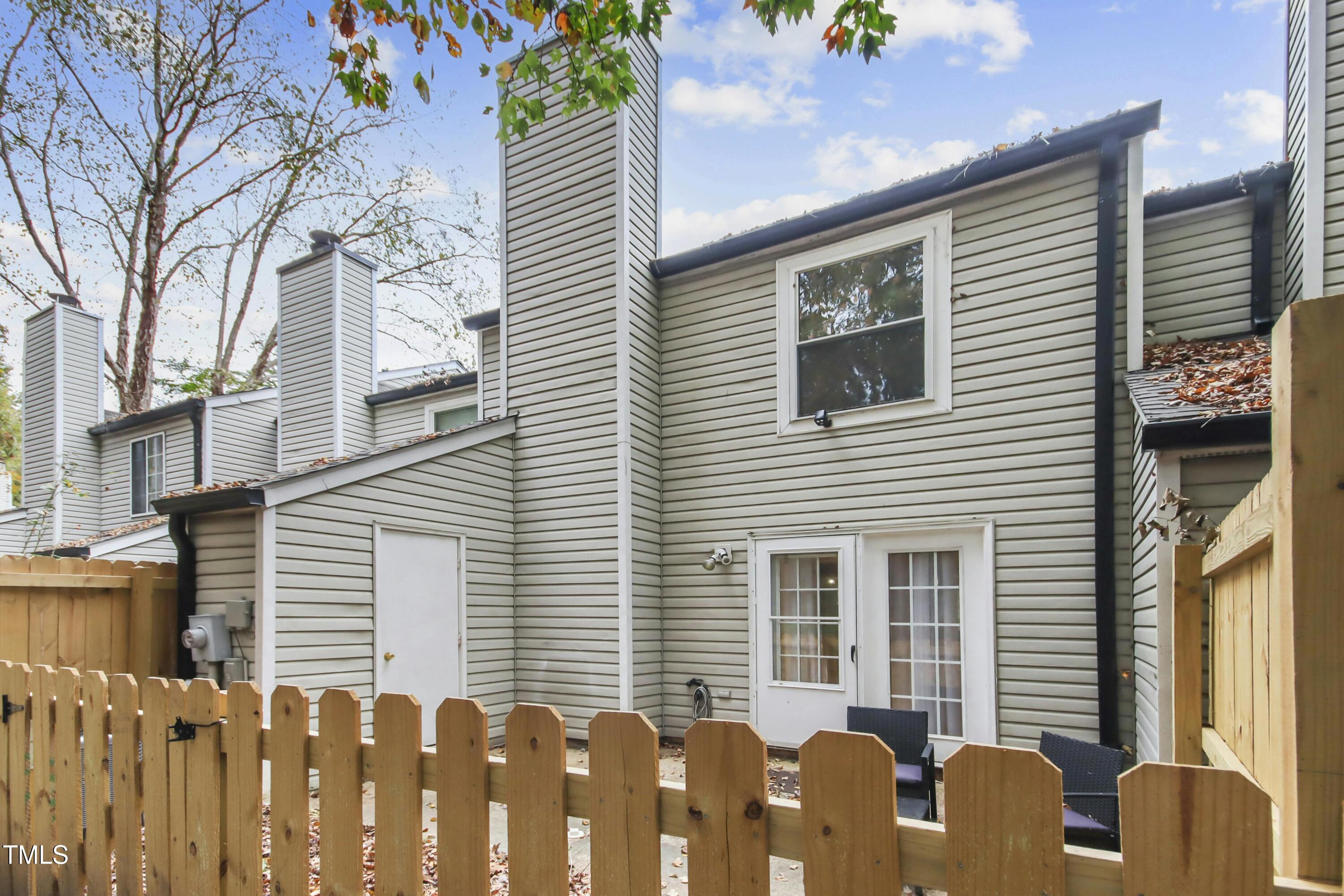 7803 Stephanie Lane Raleigh, NC 27615 - Photo 25 of 30 a front view of a house with a garden