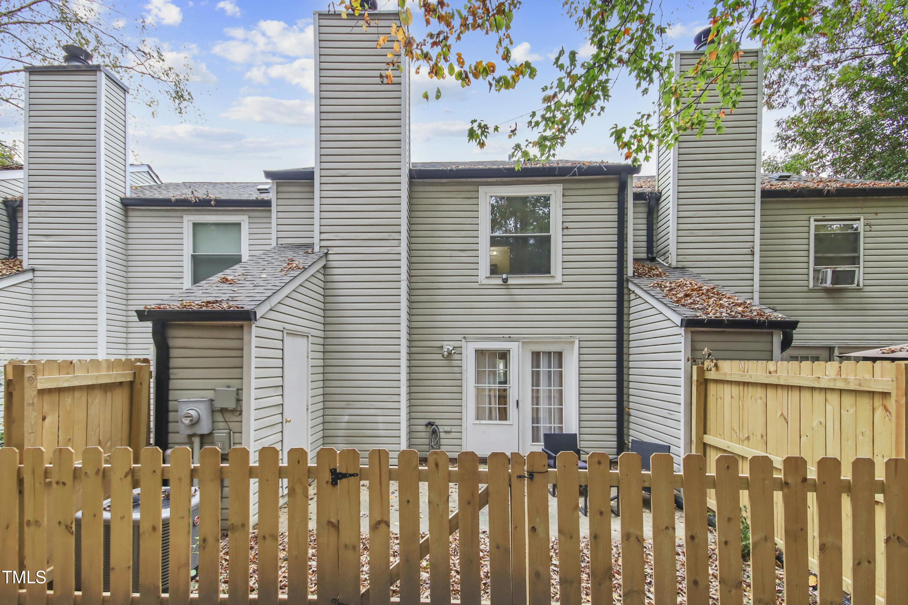 7803 Stephanie Lane Raleigh, NC 27615 - Photo 26 of 30 a front view of a house with a garden