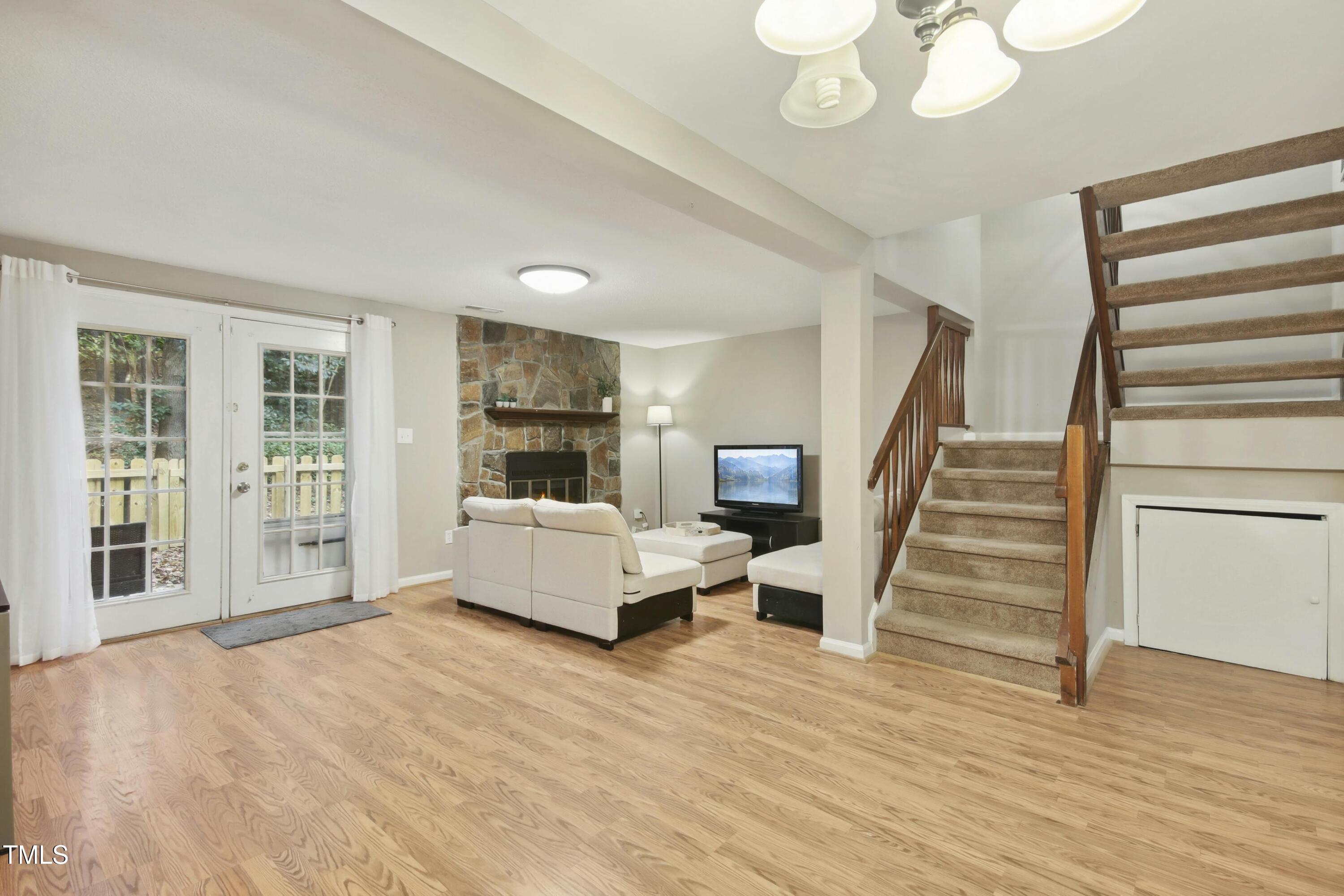 7803 Stephanie Lane Raleigh, NC 27615 - Photo 3 of 30 a living room with furniture and a wooden floor