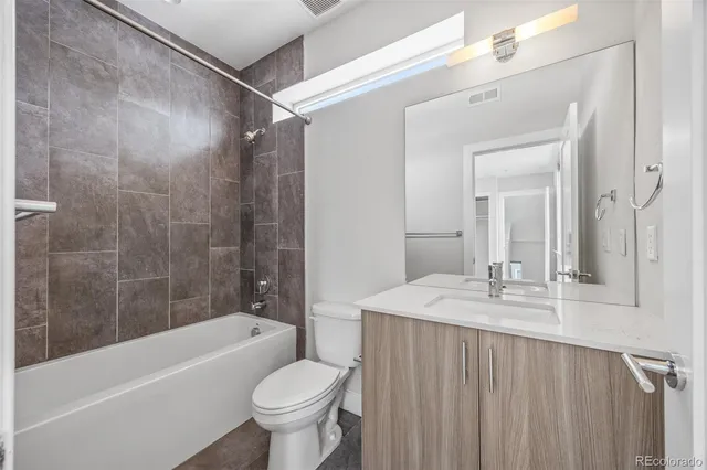 a bathroom with a sink a toilet and a bathtub