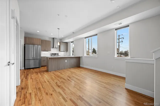 a view of kitchen with wooden floor