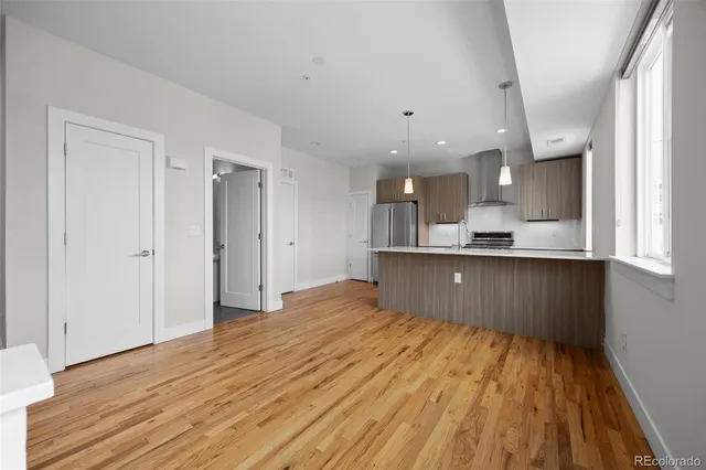 a view of kitchen with wooden floor
