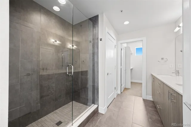 a bathroom with a shower and a sink