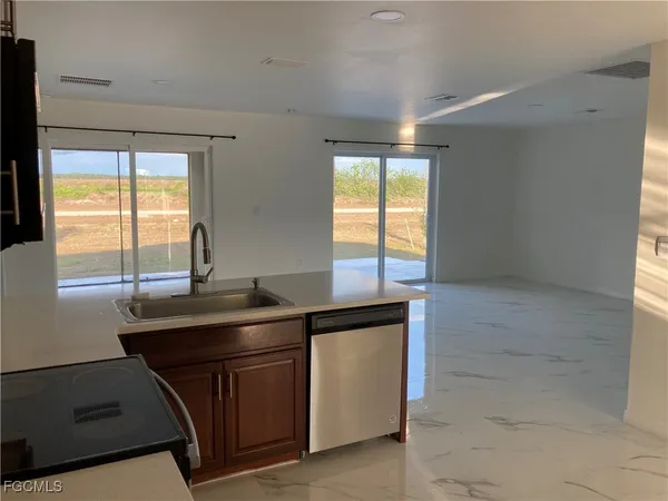 a kitchen with a sink and a window