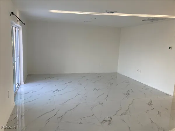 a view of an empty room and window
