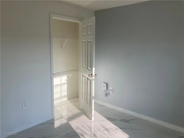 a view of a hallway with a room