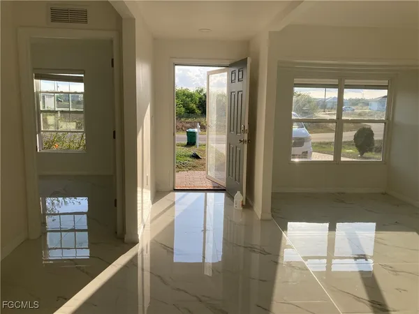 a view of a hallway with windows