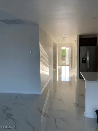 wooden floor in a hall with an entryway