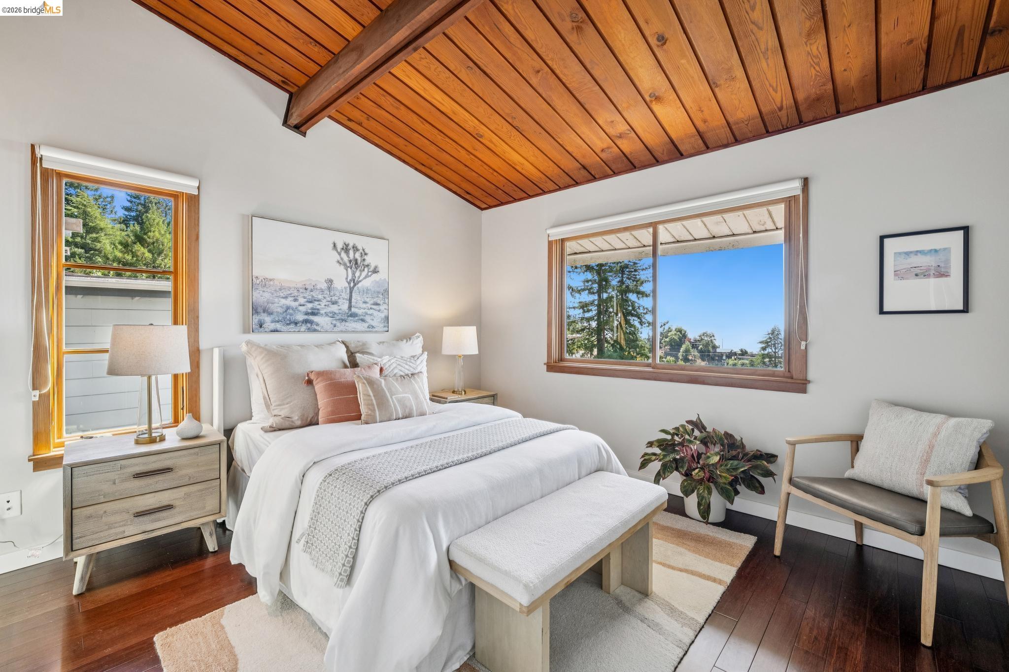 1394 Queens Road Berkeley, CA 94708 - Photo 32 of 63 Vaulted wood-paneled ceiling with exposed beams, rich wood-finish flooring, and multiple windows with wood trim