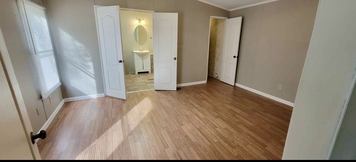 1941 Evans Road Clarksville, TN 37042 - Photo 4 of 6 a view of a hallway with wooden floor and staircase