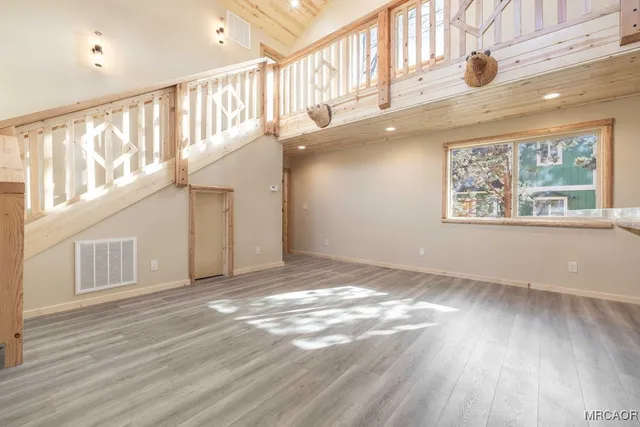 a kitchen with granite countertop a stove cabinets and stainless steel appliances
