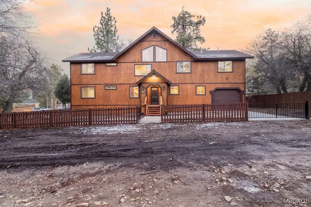a view of house with a yard