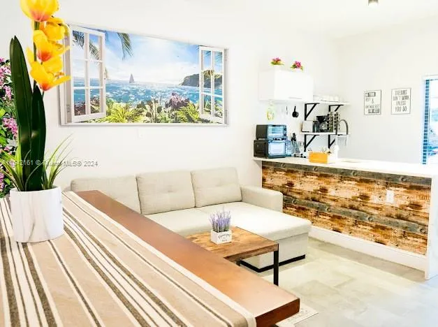 a white toilet sitting next to a shower curtain