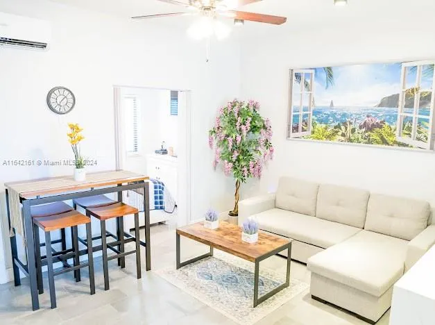 a living room with patio furniture and window