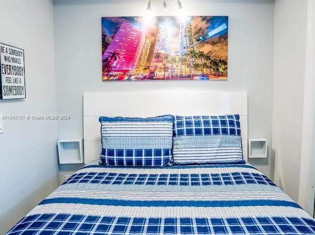 a kitchen with a sink appliances and cabinets