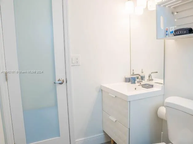 a living room with furniture and flowers