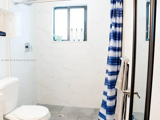 a bed room with a bed and a couch