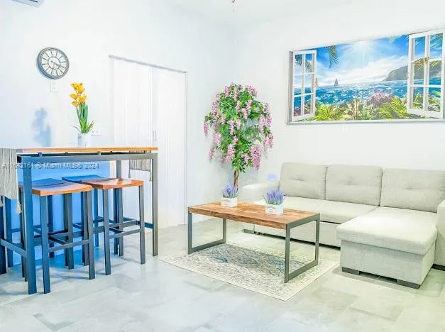 a bathroom with a sink a toilet a shower and a mirror