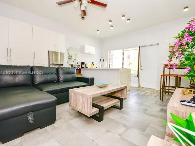 a bedroom with a bed and a potted plant