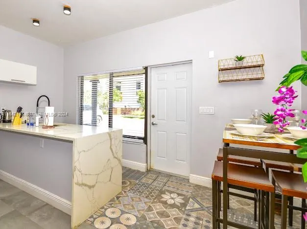 a bathroom with a sink mirror vanity and toilet
