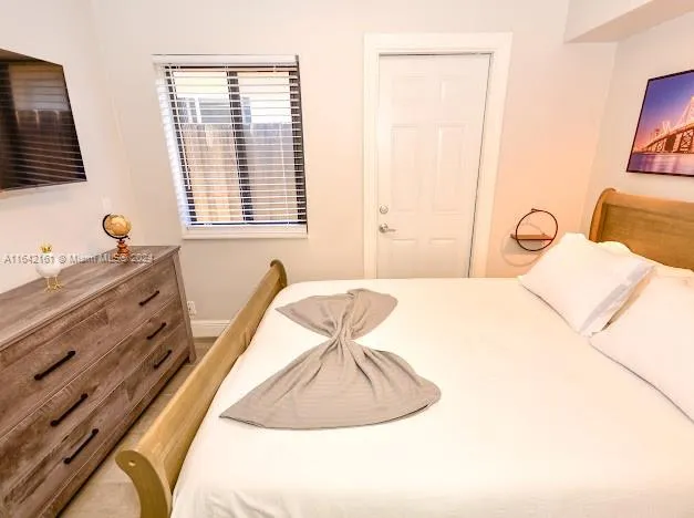 a kitchen with stainless steel appliances kitchen island granite countertop a sink stove and cabinets