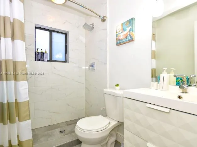 a living room with furniture and flowers