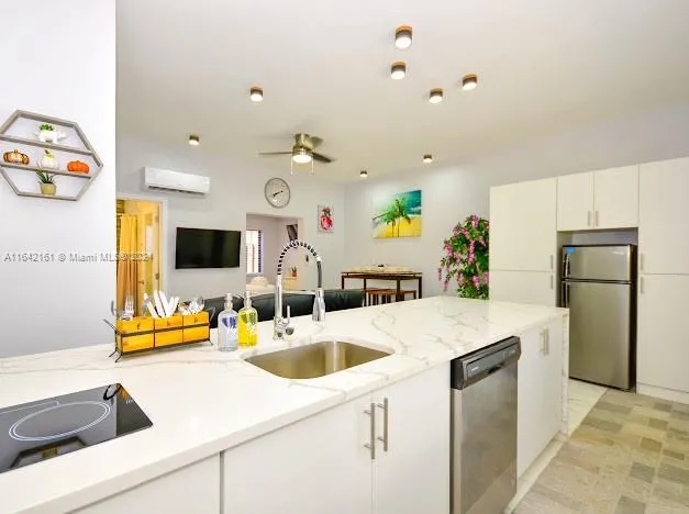 a bathroom with a sink a vanity and mirror
