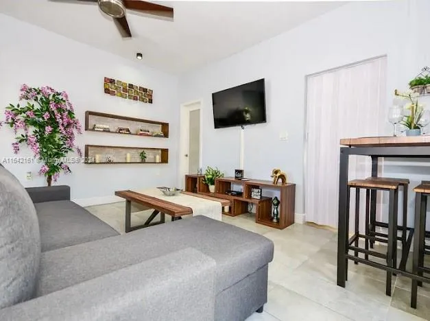 a kitchen with stainless steel appliances granite countertop a sink and a refrigerator