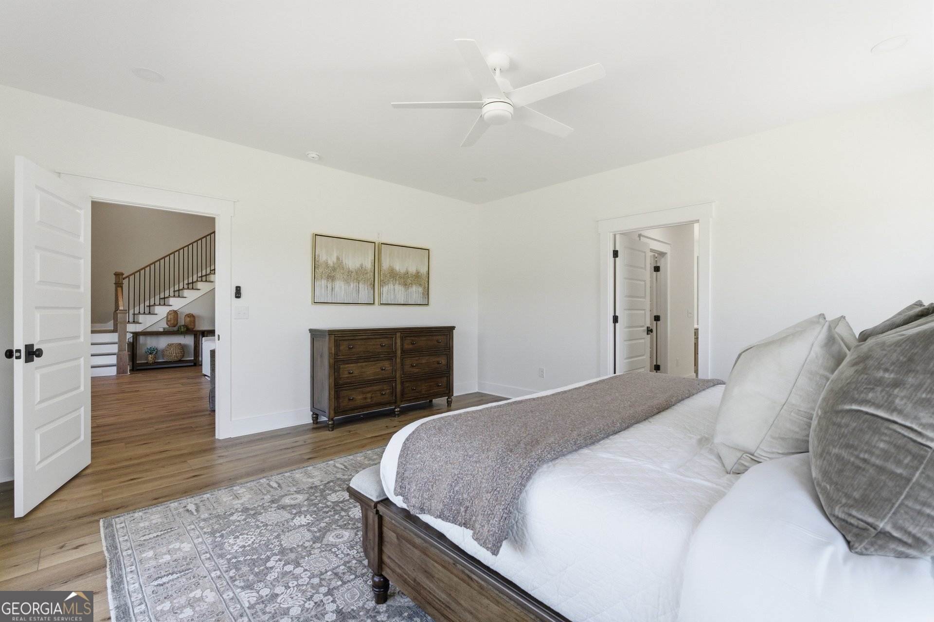 5938 Ridgeway Road Franklin, GA 30217 - Photo 19 of 41 a spacious bedroom with a bed and a fireplace