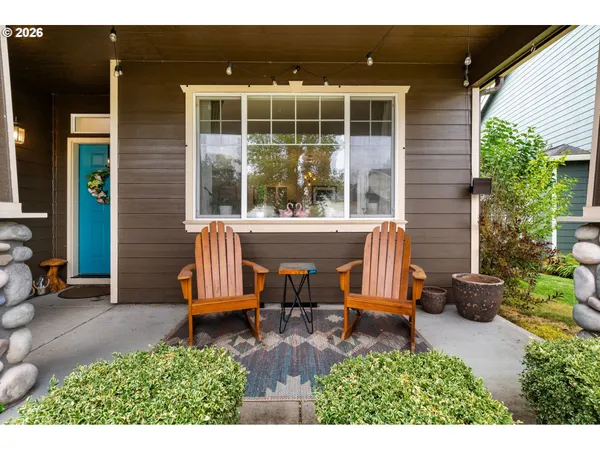 a view of a house with a chairs in patio
