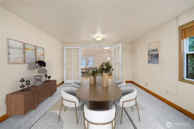 a dining room with furniture and window