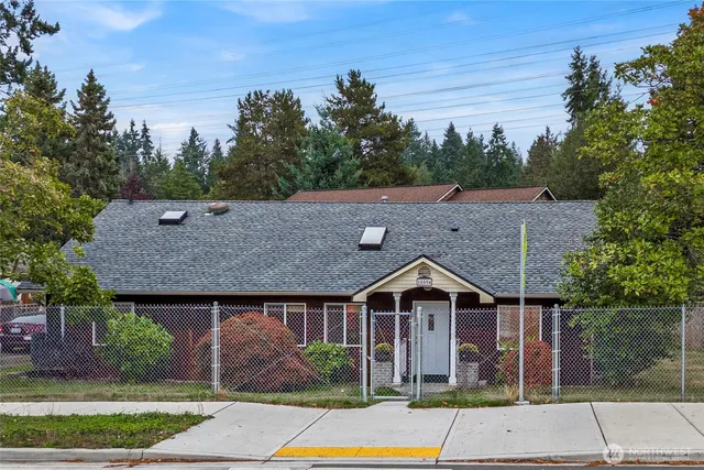 an aerial view of a house with a yard