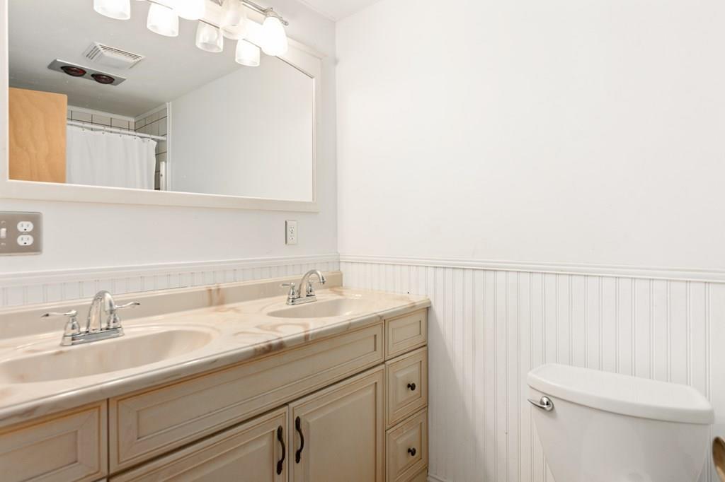 12 South Road Exeter, NH 03833 - Photo 35 of 42 a bathroom with a sink vanity mirror and toilet