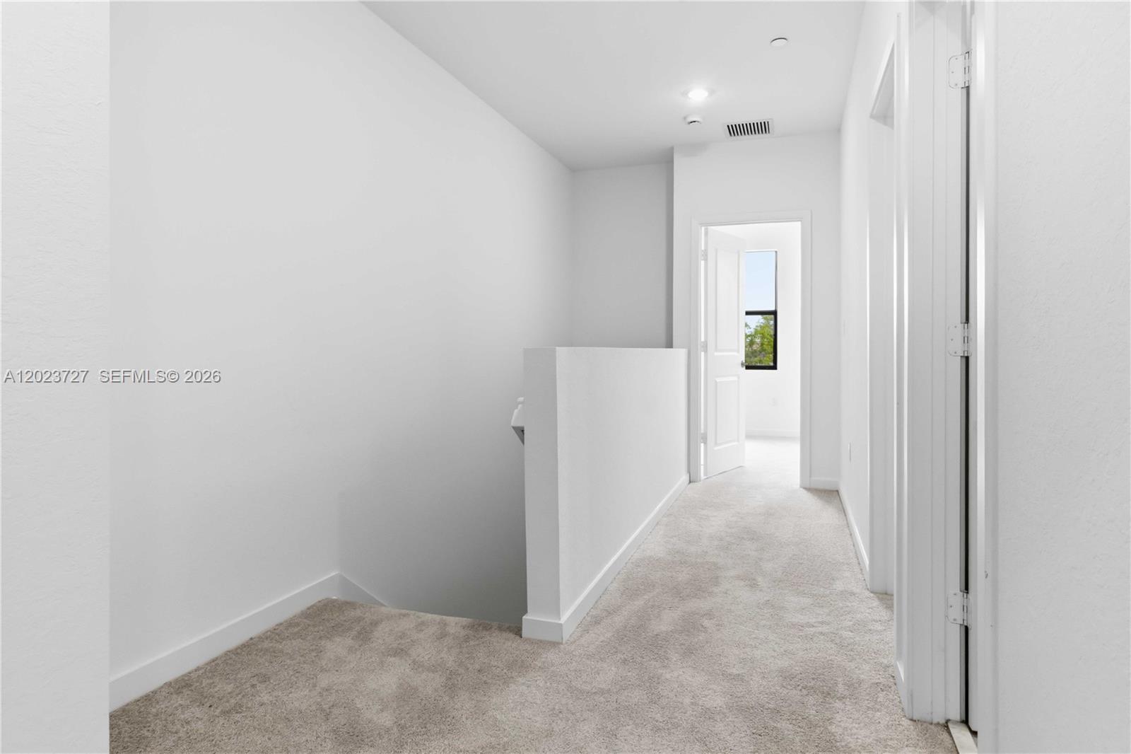 22348 Southwest 115th Court, Unit 22348 Miami, FL 33170 - Photo 27 of 37 a view of a hallway with white walls